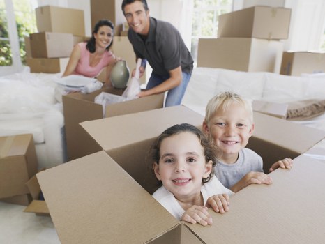 Packed boxes and furniture for house removals in a Brompton property