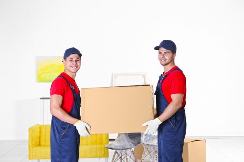 Packed office furniture and moving boxes prepared for a business move