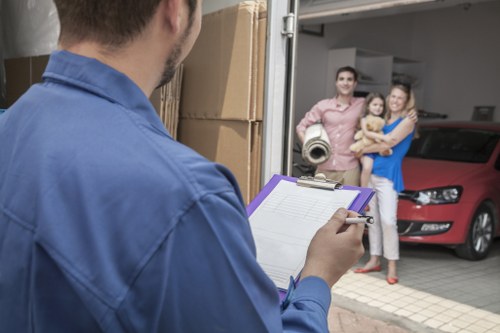 Furniture and boxes being loaded into a moving truck