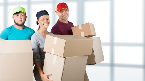 Labelled moving boxes and packing materials prepared for a Brompton relocation