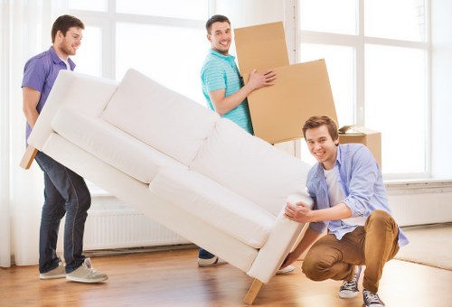 Team handling household items during transport