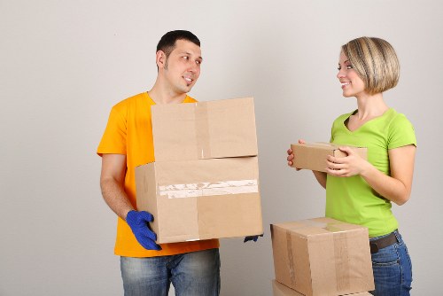 Professional moving team loading household items in Brompton