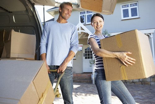 Packed household boxes and furniture ready for Brompton house removals