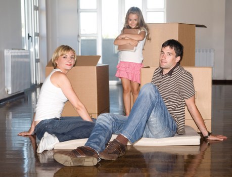 Loading furniture and boxes into a van near Brompton